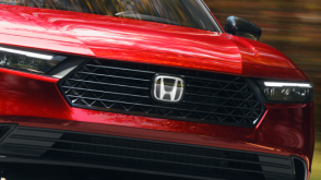 Closeup of front grille on a red Accord.