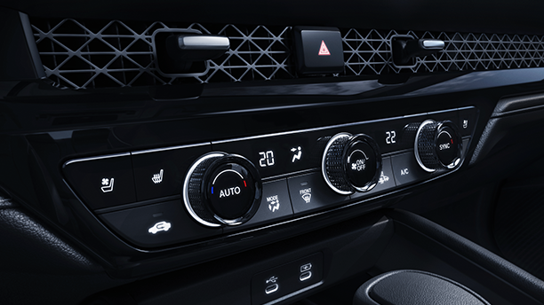 3/4 closeup view of the climate controls in the centre console.