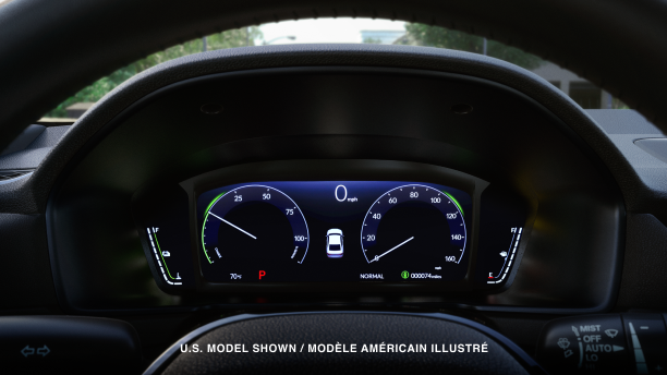 Closeup of TFT screen seen through the steering wheel. 