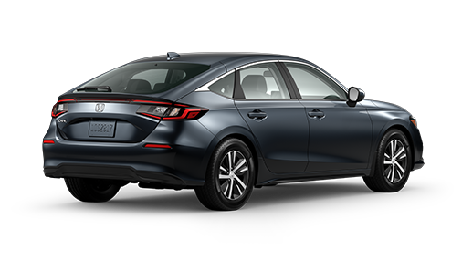 ¾ driver side rear facing view of 2023 Civic Hatchback LX model in Meteoroid Gray Metallic colour