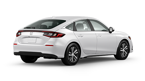 ¾ driver side rear facing view of 2023 Civic Hatchback LX model in Platinum White Pearl colour