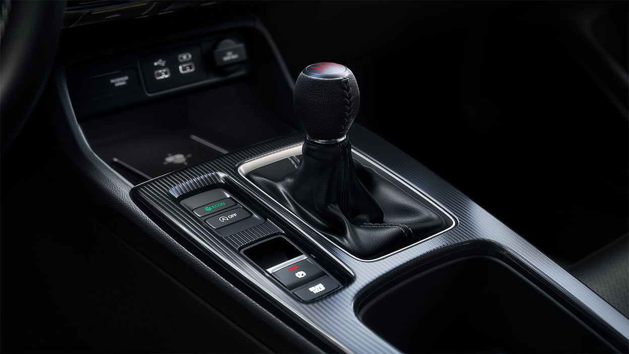 Closeup of six speed manual transmission gear shifter.