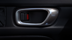 Closeup of interior door handle and lock. 