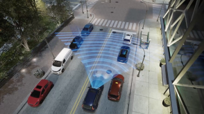 3/4 rear bird’s eye view of blue CR-V in city traffic. Blue sensor waves and lines emit from the front. 