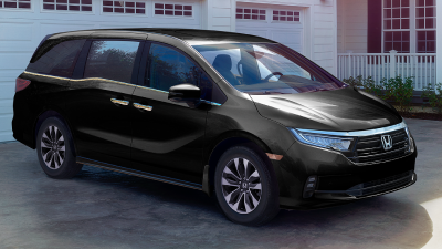 3/4 front side view of black Odyssey parked in driveway.