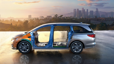 Sideview of Odyssey’s body structure. Cityscape in the background.