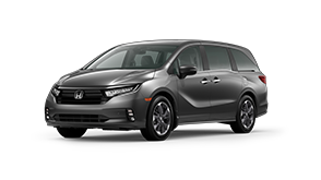 ¾ driver side front facing view of 2023 Odyssey Touring model in Modern Steel Metallic colour