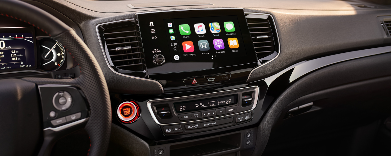 Closeup of main menu on centre console touchscreen.