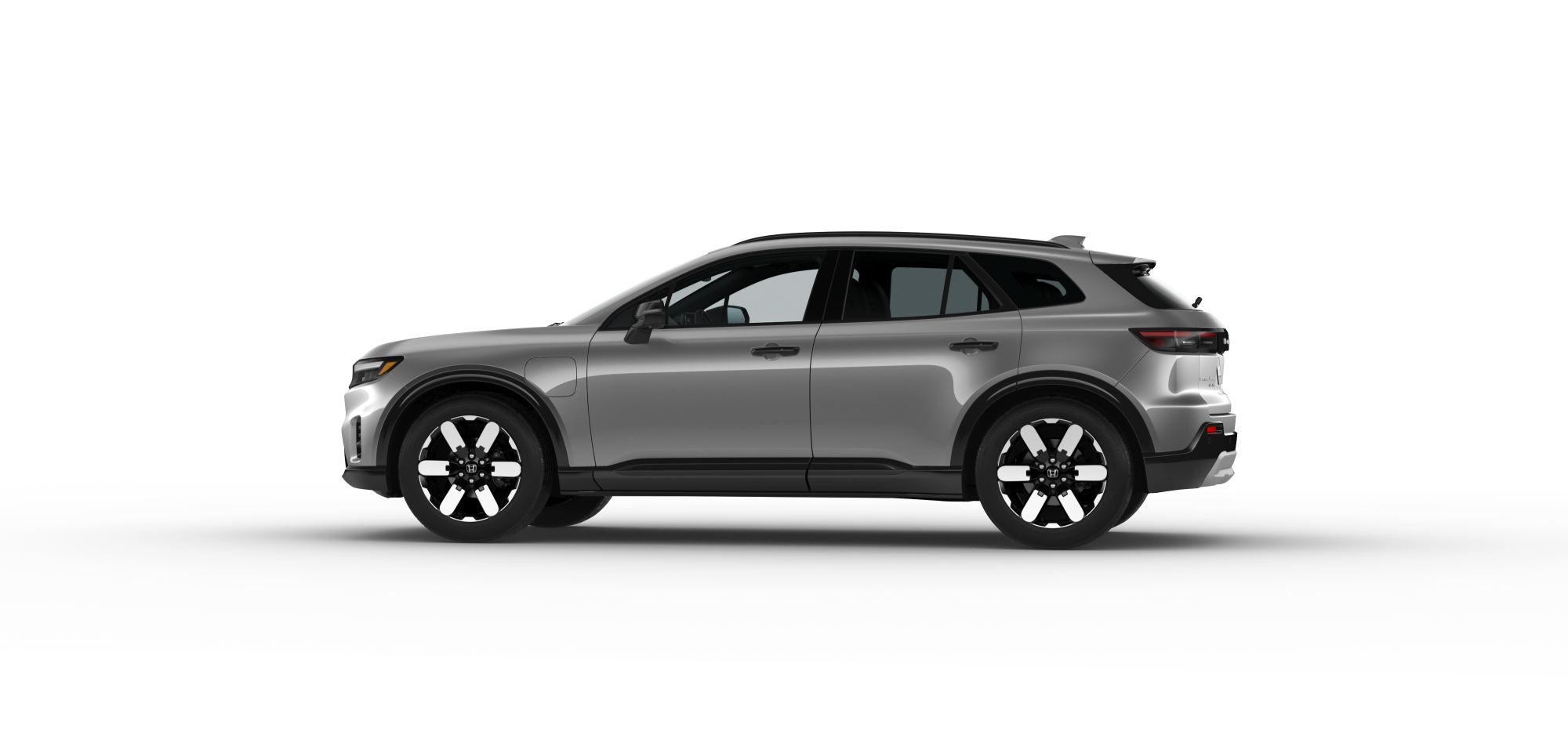 Side driver-side view of 2024 Prologue in Mercury Silver Metallic colour on white space.