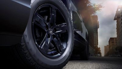 Closeup of black aluminum-alloy wheel on Ridgeline.