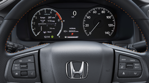 Closeup of steering wheel and TFT Center Meter Display, showcasing speedometer, tachometer, odometer, and other info.