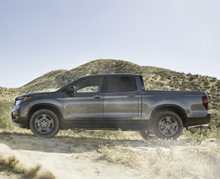 Side view of grey Ridgeline on desert hills.