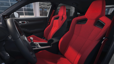 Interior wide shot of the two front red bucket sports seats.